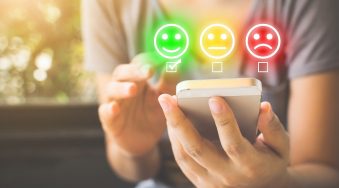 Customer Service Experience and Business Satisfaction Survey. Woman choose face smile on smart phone