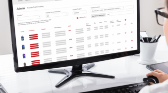 Order from suppliers with Payzerware's supplier catalog. A woman is sitting at her computer, viewing the supplier catalog portal inside of Payzerware. From this screen she can add parts to a purchase order and order from her supplier.