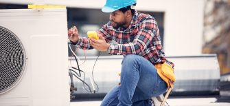 Air conditioner, cables and technician man ac repair, maintenance or working on electrical power generator. African person, electrician or contractor with electricity, heat pump check and engineering