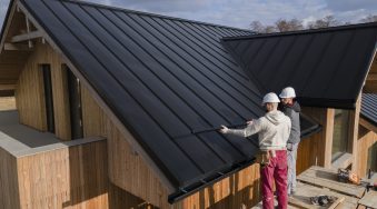 full-shot-roofers-working-together-with-helmets