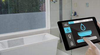 hand-holding-digital-tablet-with-home-security-icons-screen