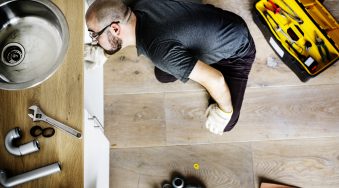 Man fixing kitchen sink